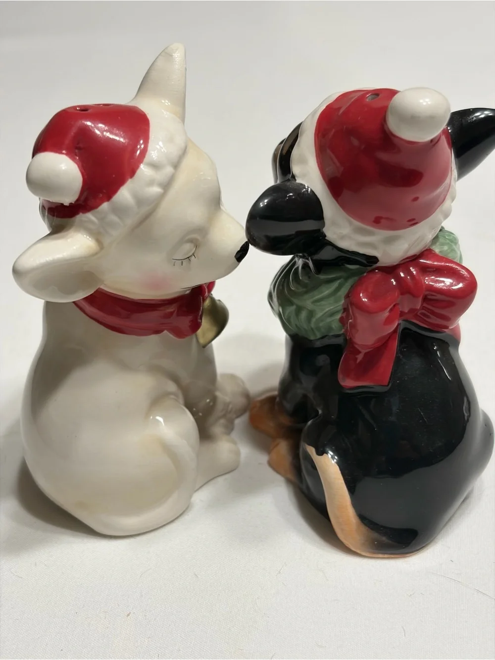 Chi Chi  Ceramic Salt and Pepper Shakers. Magnetic kissing.